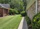 A charming single-story brick home with a well-manicured lawn and mature trees at 6542 Wellington Dr., Murrells Inlet, SC 29576