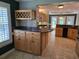 Open-concept kitchen with granite countertops, custom cabinetry, and a wine rack feature at 6542 Wellington Dr., Murrells Inlet, SC 29576