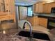 Well-appointed kitchen with granite countertops, stainless steel appliances, and custom wood cabinets at 6542 Wellington Dr., Murrells Inlet, SC 29576