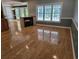 Spacious living room featuring hardwood floors, a fireplace, and a large window at 6542 Wellington Dr., Murrells Inlet, SC 29576