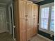Large pantry with custom built-in shelving offering ample storage, enhanced by bright natural light at 6542 Wellington Dr., Murrells Inlet, SC 29576