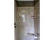 Modern shower features a built-in seat and shelving for ultimate convenience and storage at 6542 Wellington Dr., Murrells Inlet, SC 29576