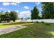 A spacious backyard features a storage shed and a white privacy fence at 704 Bonnie Dr., Myrtle Beach, SC 29588