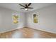 Bright bedroom with natural light, hardwood floors, and a ceiling fan at 704 Bonnie Dr., Myrtle Beach, SC 29588