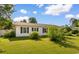 Exterior shot of a charming single-story home with a lush green lawn at 704 Bonnie Dr., Myrtle Beach, SC 29588