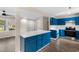 Open layout connects the updated kitchen with a central island to the naturally lit living area for seamless entertaining at 704 Bonnie Dr., Myrtle Beach, SC 29588