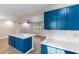 The open-concept kitchen featuring a large island with quartz countertop with the living space is airy and bright at 704 Bonnie Dr., Myrtle Beach, SC 29588