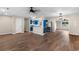 Open-concept living room and kitchen with stainless steel appliances and hardwood floors at 704 Bonnie Dr., Myrtle Beach, SC 29588