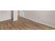 Living area featuring wood floors, white baseboards, and modern outlets at 704 Bonnie Dr., Myrtle Beach, SC 29588