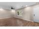 Bright living room features fresh paint, modern ceiling fan and new floors adding charm and character to this space at 704 Bonnie Dr., Myrtle Beach, SC 29588