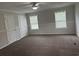 Spacious bedroom with carpeting and two windows at 71 Mohican Dr., Georgetown, SC 29440