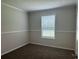 Well-lit bedroom with neutral carpeting, base molding and natural light at 71 Mohican Dr., Georgetown, SC 29440