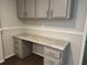 Cozy home office area featuring a desk, drawers, and overhead cabinets for storage and organization at 71 Mohican Dr., Georgetown, SC 29440
