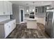 Modern kitchen featuring stainless steel appliances and a stylish center island with marble countertop at 71 Mohican Dr., Georgetown, SC 29440
