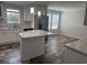 Beautiful kitchen with a marble island, stainless steel refrigerator, and white cabinets at 71 Mohican Dr., Georgetown, SC 29440
