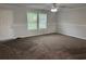 Neutral living area with carpet, ceiling fan, and natural light at 71 Mohican Dr., Georgetown, SC 29440