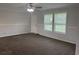 Neutral living area with carpet, ceiling fan, and natural light at 71 Mohican Dr., Georgetown, SC 29440