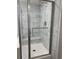 Glass-enclosed shower with marble tile and built-in seat at 71 Mohican Dr., Georgetown, SC 29440