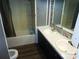 Bathroom features a double sink vanity, mirrored backsplash, and shower-tub combo at 742 Se Hebron Dr., Conway, SC 29527