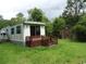 View of home exterior with outdoor deck and storage shed at 742 Se Hebron Dr., Conway, SC 29527