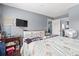 Comfortable bedroom featuring wood floors, a television, and neutral colored walls at 7700 Porcher Dr. # 3205, Myrtle Beach, SC 29572