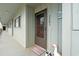 Inviting condo front door with charming beach decor and beach welcome mat at 7700 Porcher Dr. # 3205, Myrtle Beach, SC 29572
