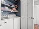 Cozy laundry area featuring a white washer and dryer with white wire rack at 7700 Porcher Dr. # 3205, Myrtle Beach, SC 29572