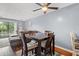 Open floor plan living and dining space featuring wood floors, ceiling fan and patio at 7700 Porcher Dr. # 3205, Myrtle Beach, SC 29572