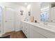 Bright bathroom with double sink vanity, white cabinets, and stylish decor at 798 Woodland Farms Circle, Aynor, SC 29511