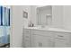Bright bathroom with a white vanity and a large mirror perfect for getting ready at 798 Woodland Farms Circle, Aynor, SC 29511