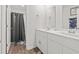 Bright bathroom features a double sink vanity and modern fixtures at 798 Woodland Farms Circle, Aynor, SC 29511