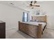 Comfortable bedroom features a wooden bed frame, soft carpet, and a modern ceiling fan at 798 Woodland Farms Circle, Aynor, SC 29511
