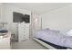 Well-lit bedroom featuring a comfortable bed, dresser, and neutral carpet at 798 Woodland Farms Circle, Aynor, SC 29511