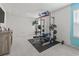 Bright gym with weight training machine, neutral carpet, and natural light at 798 Woodland Farms Circle, Aynor, SC 29511