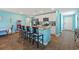 Bright, open kitchen with white cabinets, granite countertops, stainless steel appliances, and island seating at 798 Woodland Farms Circle, Aynor, SC 29511