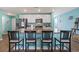 Spacious kitchen featuring granite countertops, white cabinets, stainless steel appliances, and seating at the island at 798 Woodland Farms Circle, Aynor, SC 29511