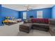 Comfortable living room with plush carpeting, a sectional sofa, and a view of large model airplanes at 798 Woodland Farms Circle, Aynor, SC 29511