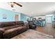 Spacious living room connected to the kitchen with stainless steel appliances and a breakfast bar at 798 Woodland Farms Circle, Aynor, SC 29511