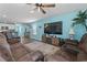 Inviting living room features a ceiling fan, TV, and a comfortable leather reclining sofa at 798 Woodland Farms Circle, Aynor, SC 29511