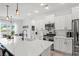Modern kitchen with a large island, white cabinets, and stainless steel appliances at 8016 Old Reaves Ferry Rd., Conway, SC 29526