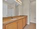 Bathroom with a double sink vanity, granite countertop, and large mirror at 945 Rosencrans Ln. # B, Myrtle Beach, SC 29577