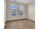 Bright bedroom with hardwood floors and two large windows for natural lighting at 945 Rosencrans Ln. # B, Myrtle Beach, SC 29577
