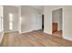 Bright bedroom with hardwood floors, closet, and adjoining bathroom with a vanity at 945 Rosencrans Ln. # B, Myrtle Beach, SC 29577
