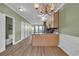 Spacious kitchen featuring an island, wood cabinets, and an open layout to dining area at 945 Rosencrans Ln. # B, Myrtle Beach, SC 29577