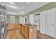 Bright kitchen features stainless appliances, granite counters and laundry behind closet doors at 945 Rosencrans Ln. # B, Myrtle Beach, SC 29577