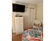 Bedroom features a dresser, TV and a wicker chair at 9501 Shore Dr. # 323, Myrtle Beach, SC 29572