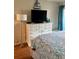 Bedroom features a television on a dresser with coastal decor at 9501 Shore Dr. # 323, Myrtle Beach, SC 29572