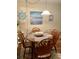Casual dining area with seating for four, coastal decor, and plenty of natural light at 9501 Shore Dr. # 323, Myrtle Beach, SC 29572