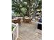 Outdoor grilling area equipped with wooden tables and chairs. A cozy space for communal barbecues and gatherings at 9501 Shore Dr. # 323, Myrtle Beach, SC 29572