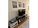 Close-up of a living room featuring a flat-screen television and coastal themed artwork at 9501 Shore Dr. # 323, Myrtle Beach, SC 29572